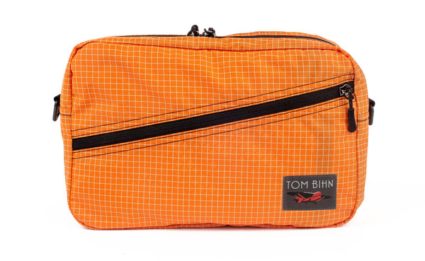 A Packing Cube Shoulder Bag in Zest (pale orange with white grid) 200 Halcyon